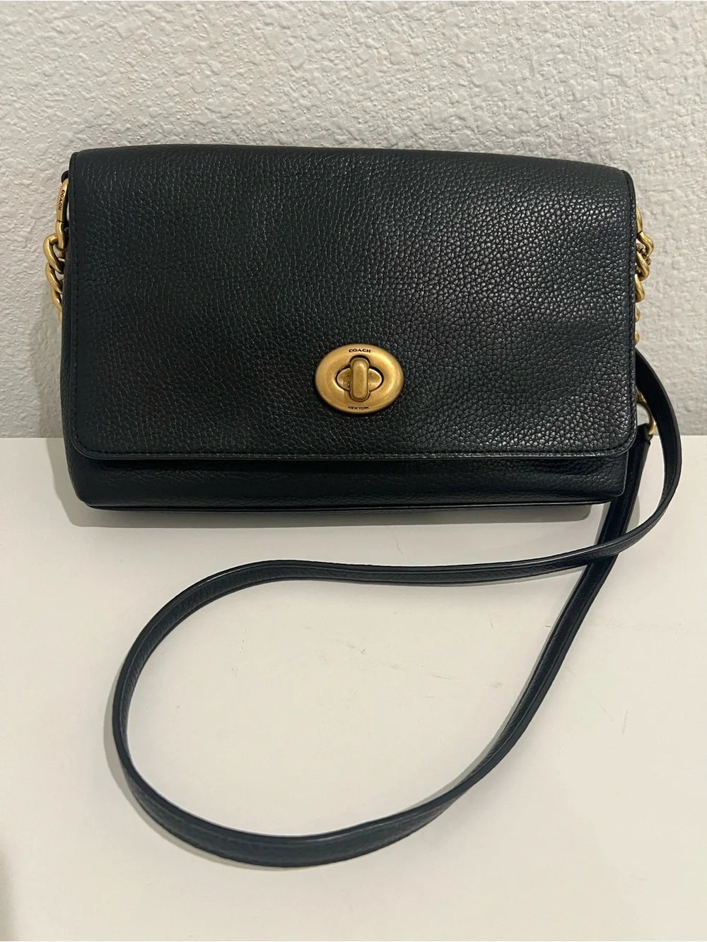 COACH Black Pebbled Leather Turnlock Shoulder Bag with gold accents.